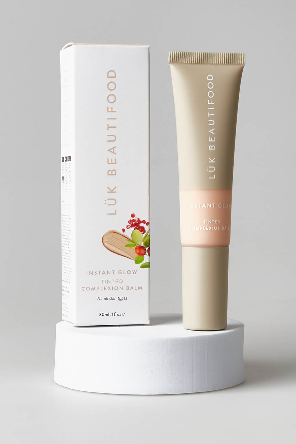 A model wearing size OneSize of the Tinted Complexion Balm in colour Fair, from the front, showing the whole outfit