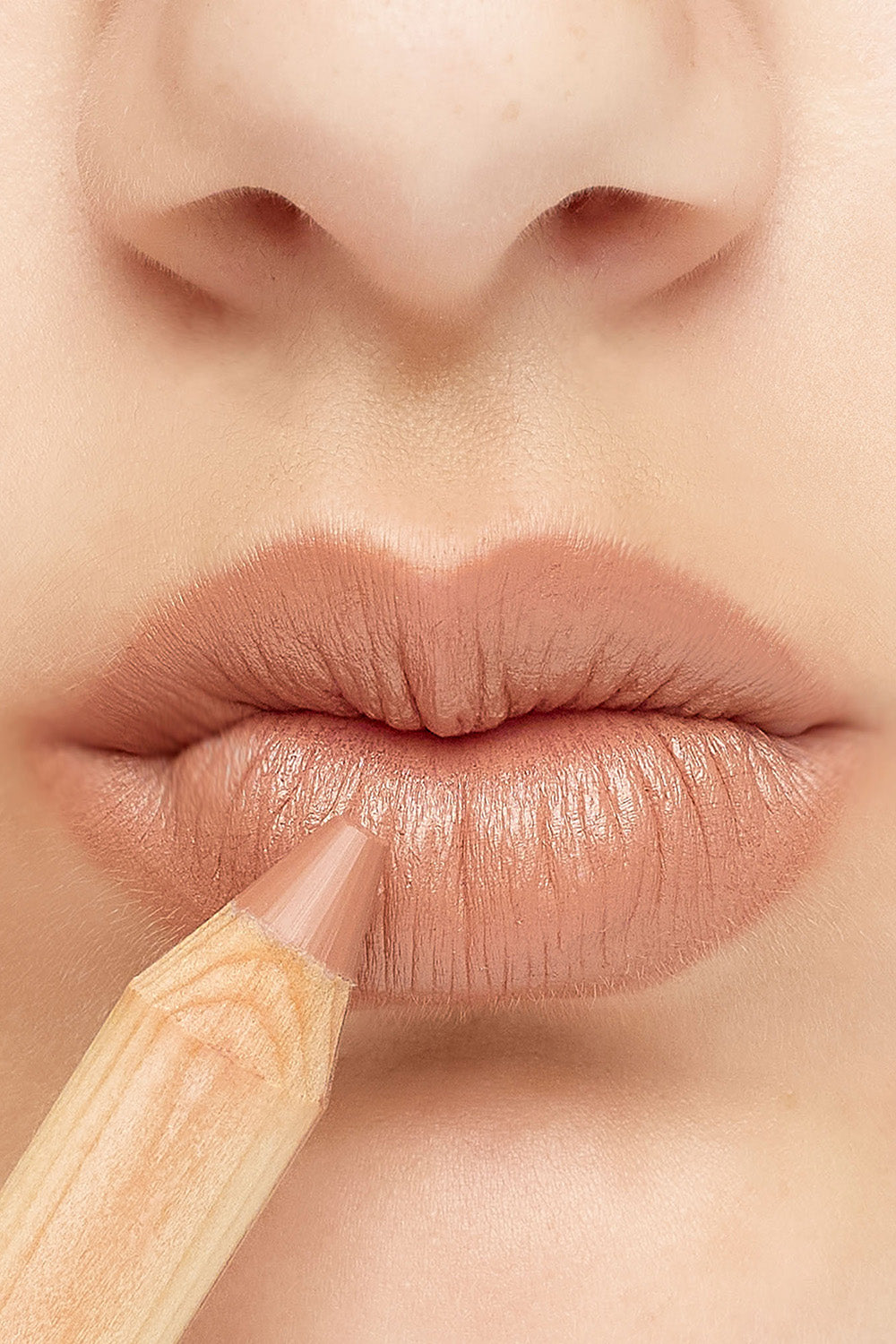 A model wearing the Lipstick Crayon Replenishment in colour Honeypeach (Pink), from the front, showing the whole outfit