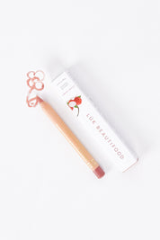 A model wearing size OneSize of the Lipstick Crayon Replenishment in colour Lycheesorb (Pink), from the front, showing the whole outfit