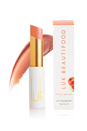 A model wearing the Peach Melon Lip Nourish in colour Orange, from the front, showing the whole outfit