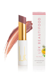 A model wearing the Tea Rose Lip Nourish in colour Rose (Pink), from the front, showing the whole outfit