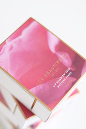 A model wearing the Lip Nourish Trio in colour Pinks (Pink), from the front, showing the whole outfit