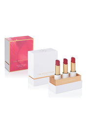 A model wearing the Lip Nourish Trio in colour Reds (Red), from the front, showing the whole outfit