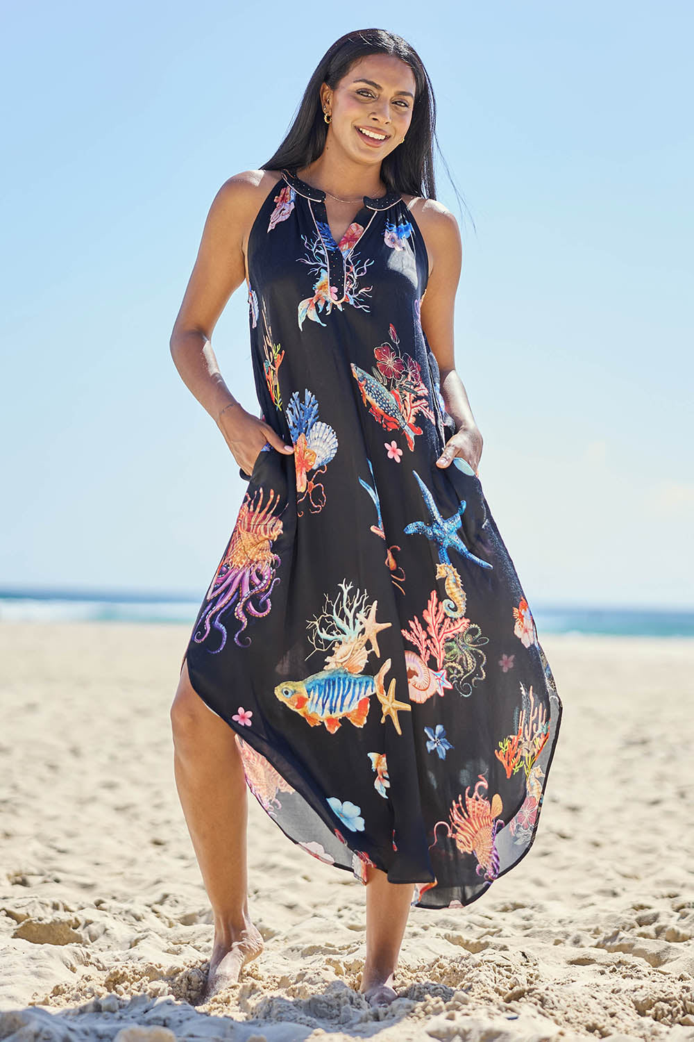 Model Eshan wearing size 10 of the Abyss Maxi Dress - Black in colour Black, from the front