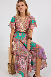 Model Genericm wearing size sample of the Algarve Wrap Dress – Violet in colour Violet, in a cropped view