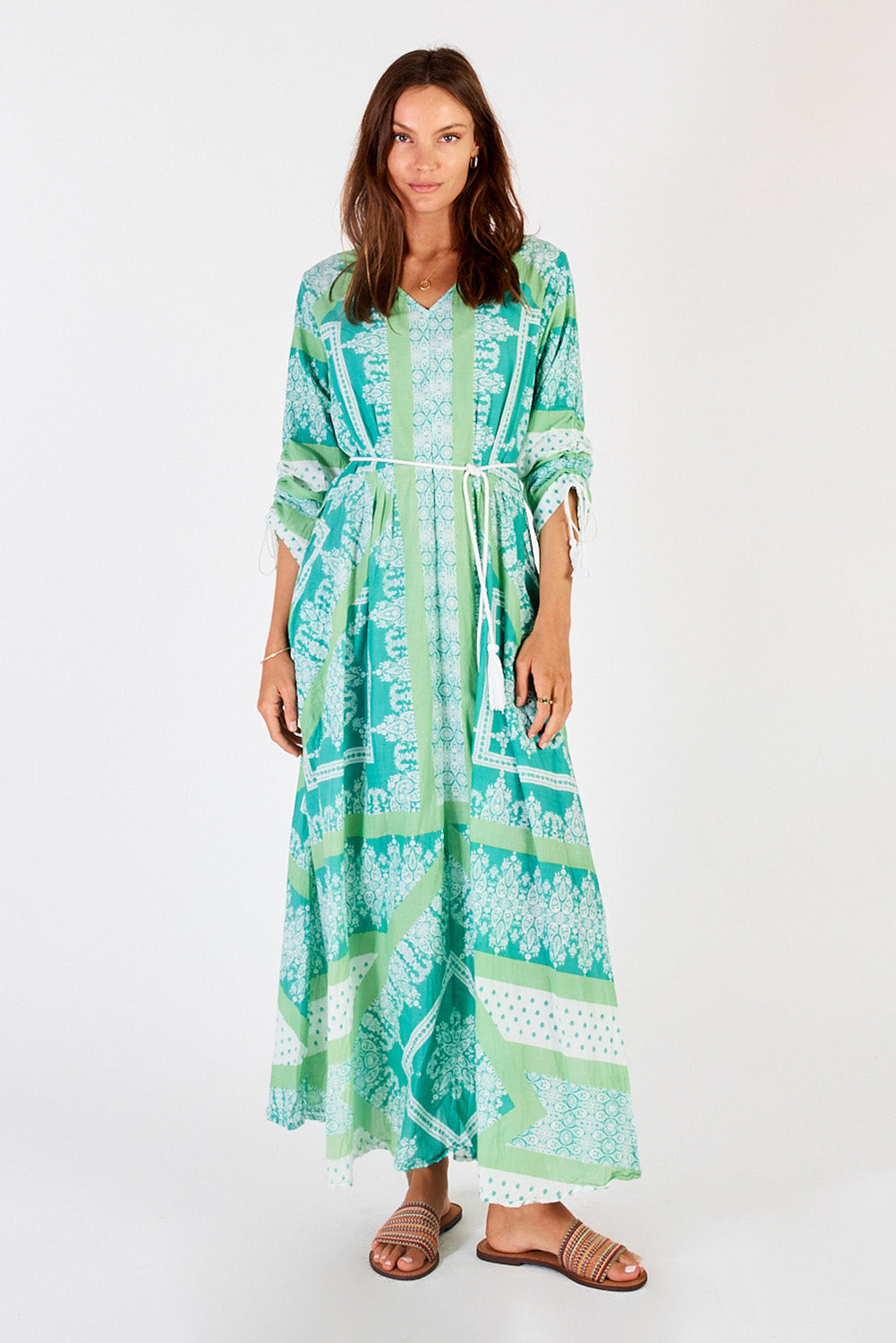 A model wearing the Bandana Cotton Maxi Dress in colour Sea (Green), from the front, showing the whole outfit