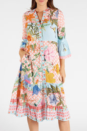 A model wearing the Belize Midi Dress in colour Mist, from the front, cropped image