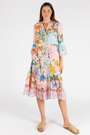 A model wearing the Belize Midi Dress in colour Mist, from the front, showing the whole outfit