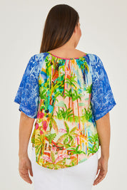 Model Georgia wearing size S of the Bon Voyage Top in colour Multi (Blue), from the back