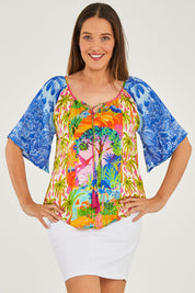 Model Georgia wearing size S of the Bon Voyage Top in colour Multi (Blue), from the front, cropped image