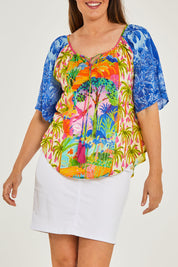 Model Georgia wearing size S of the Bon Voyage Top in colour Multi (Blue), from the front, cropped image