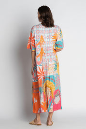 A model wearing the Busena Midi Dress in colour Mist, from the back
