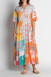 A model wearing the Busena Midi Dress in colour Mist, from the front, cropped image