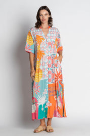 A model wearing the Busena Midi Dress in colour Mist, from the front, showing the whole outfit