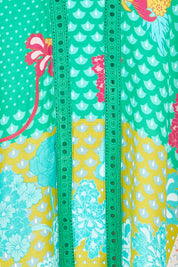 Product shot of the Camargue Dress in colour Lagoon (Green), detail