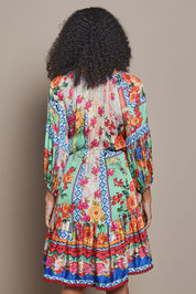 Model Ziara wearing size S of the Carlisle Dress in colour Print, from the back