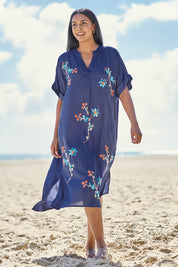 Model Eshan wearing size 10 of the Casita Kaftan Dress – Navy in colour Navy, from the front
