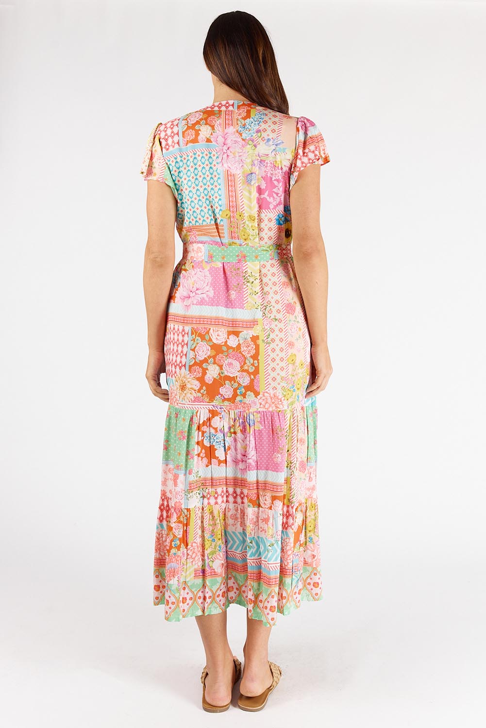 A model wearing the Costa Rica Midi Dress in colour Sea (Pink), from the back