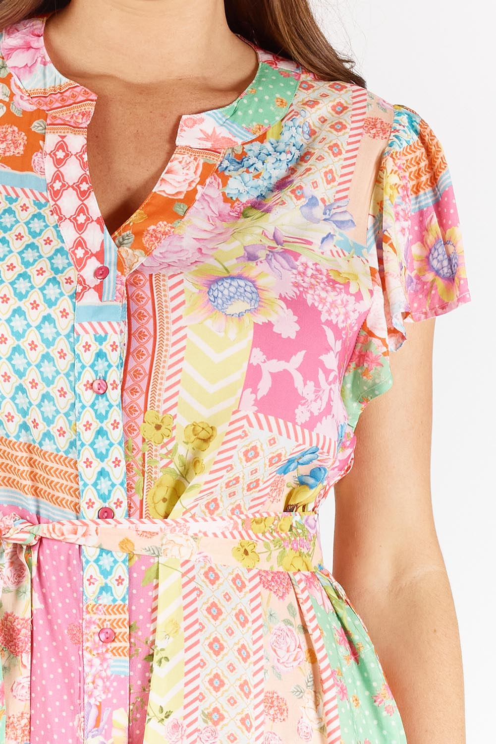 A model wearing the Costa Rica Midi Dress in colour Sea (Pink), from the front, cropped image