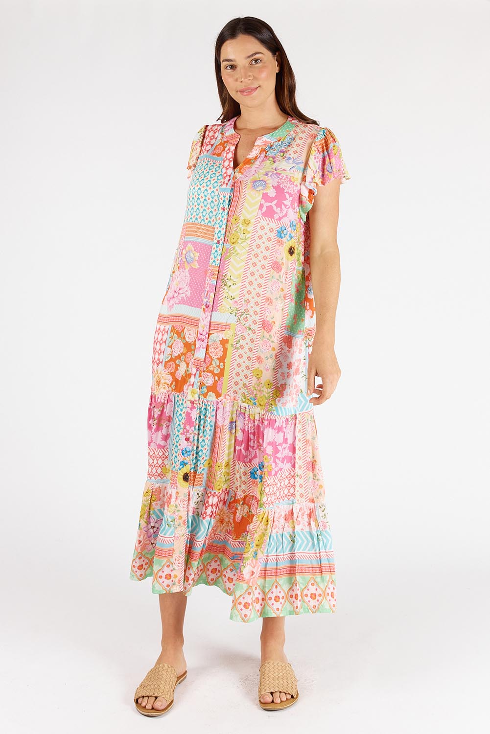A model wearing the Costa Rica Midi Dress in colour Sea (Pink), from the front, showing the whole outfit