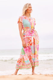 Model Phoebe wearing size S of the Costa Rica Midi Dress in colour Sea (Pink), from the front, showing the whole outfit