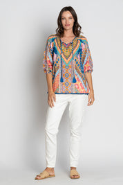 A model wearing the Danai Cotton Top in colour Ocean, from the front, showing the whole outfit