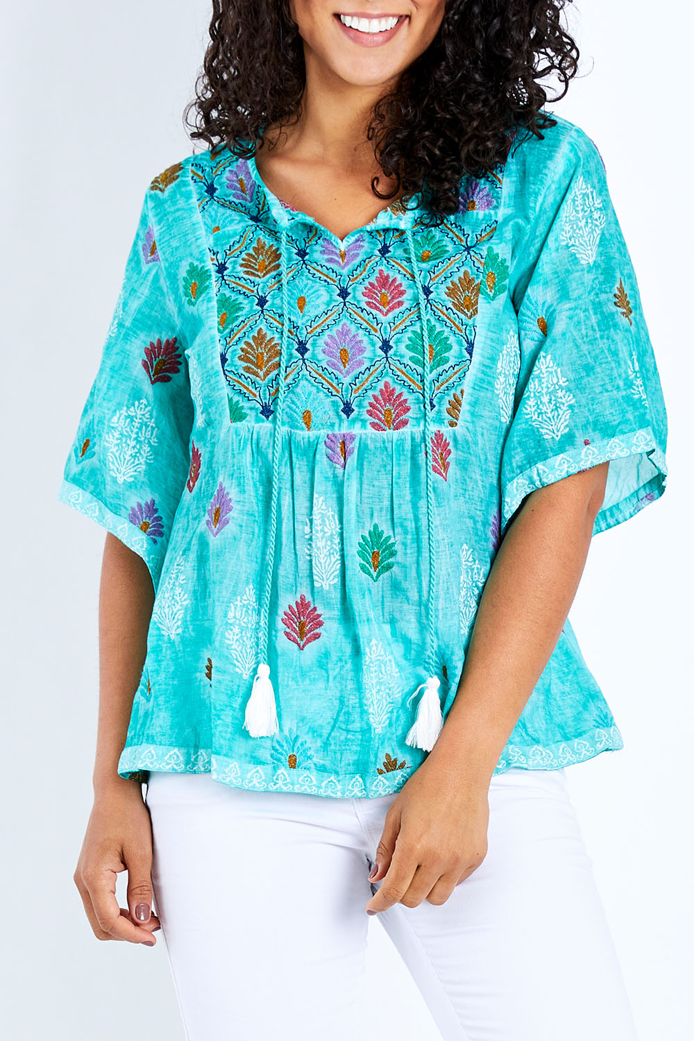 Model Pamela wearing size S of the Dixie Top in colour Sea (Green), from the front, cropped image