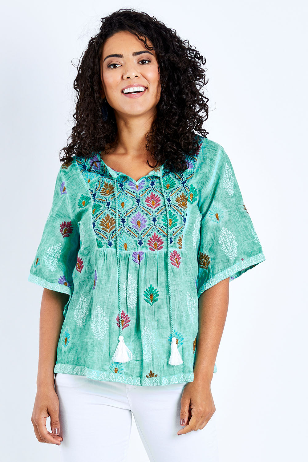 Model Pamela wearing size S of the Dixie Top in colour Sea (Green), from the front, cropped image
