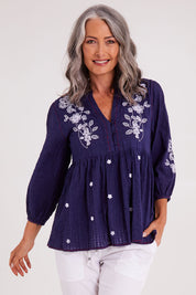 Model Luisa wearing size S of the Drew Top in colour Navy (Blue), from the front, cropped image