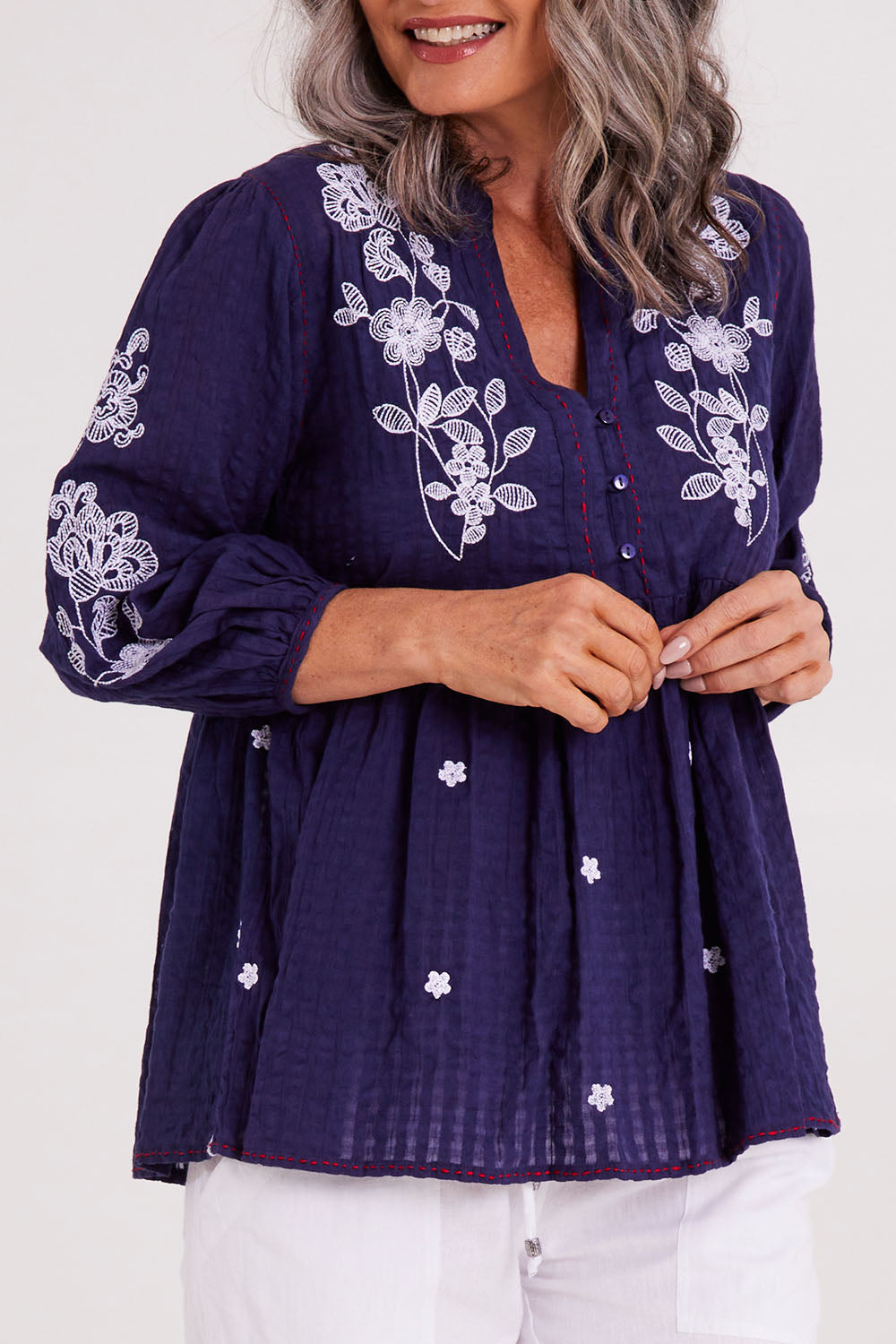 Model Luisa wearing size S of the Drew Top in colour Navy (Blue), from the front, cropped image