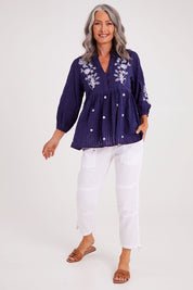 Model Luisa wearing size S of the Drew Top in colour Navy (Blue), from the front, showing the whole outfit