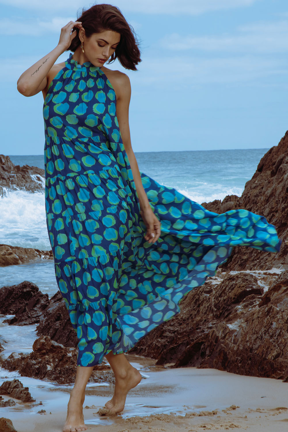 A model wearing the Ethel Midi in colour Navy (Blue), from the front, showing the whole outfit