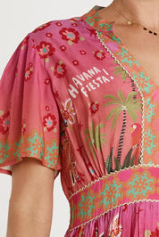 A model wearing the Fiesta Modal Blend Dress in colour Print (Pink), from the front, cropped image