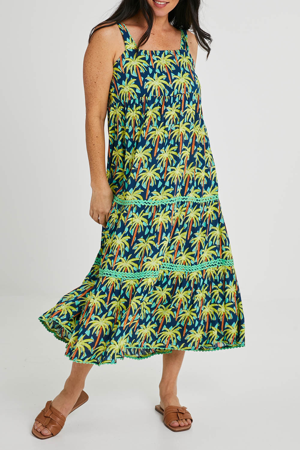 Model Katie wearing size S of the Haiti Sundress in colour Navy (Blue), from the front, cropped image