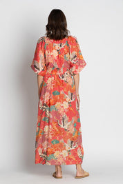 A model wearing the Hoshino Maxi in colour Pink, from the back