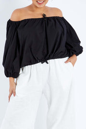 Model Sasha-Lee wearing the Kaira Top in colour Jett (Black), from the front, cropped image