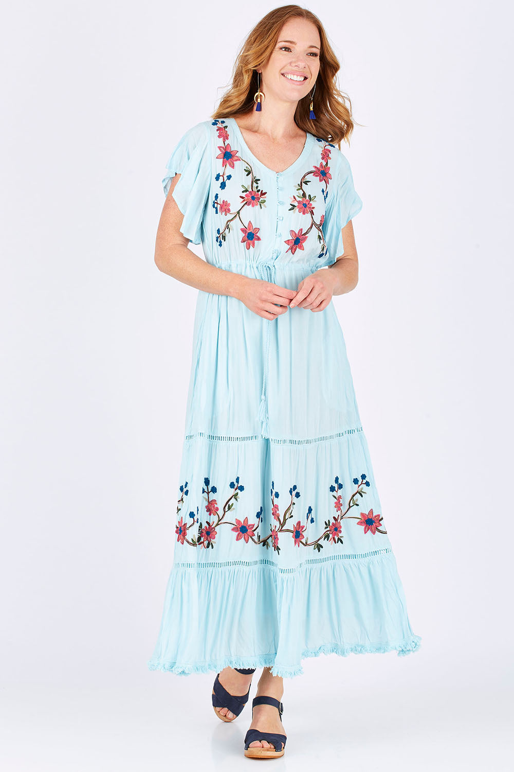 Model Katie wearing size S of the Kyoto Dress in colour Mint (Blue), from the front, showing the whole outfit