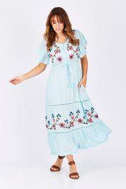 Model Laura wearing size M of the Kyoto Dress in colour Mint (Blue), from the front, showing the whole outfit