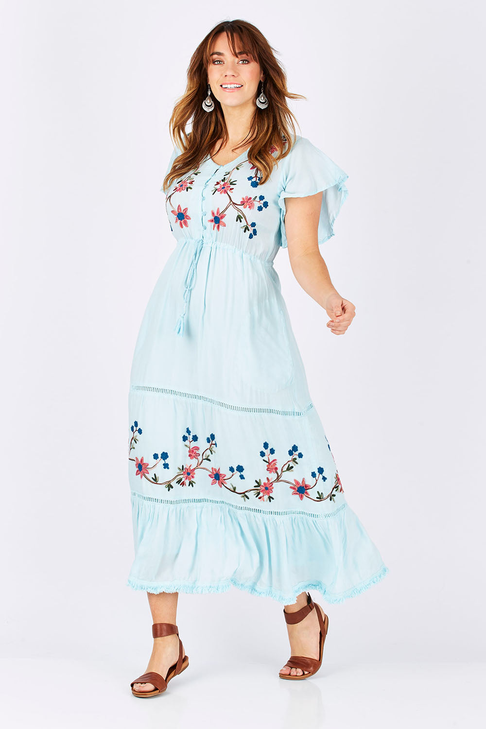 Model Laura wearing size M of the Kyoto Dress in colour Mint (Blue), from the front, showing the whole outfit