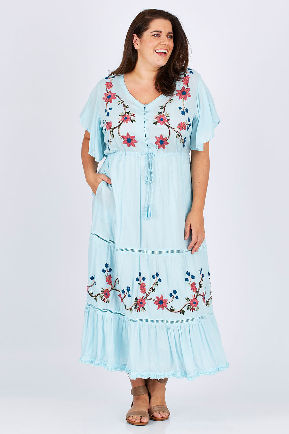 Model Mae wearing size XXL of the Kyoto Dress in colour Mint (Blue), from the front, showing the whole outfit
