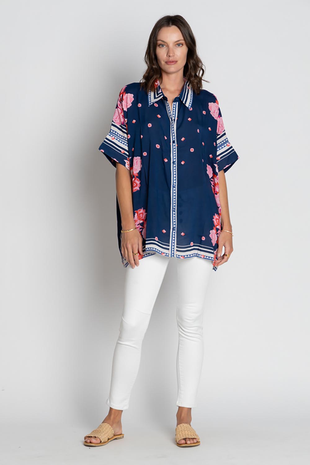 A model wearing the Ladera Kaftan Shirt in colour Navy (Blue), from the front, showing the whole outfit