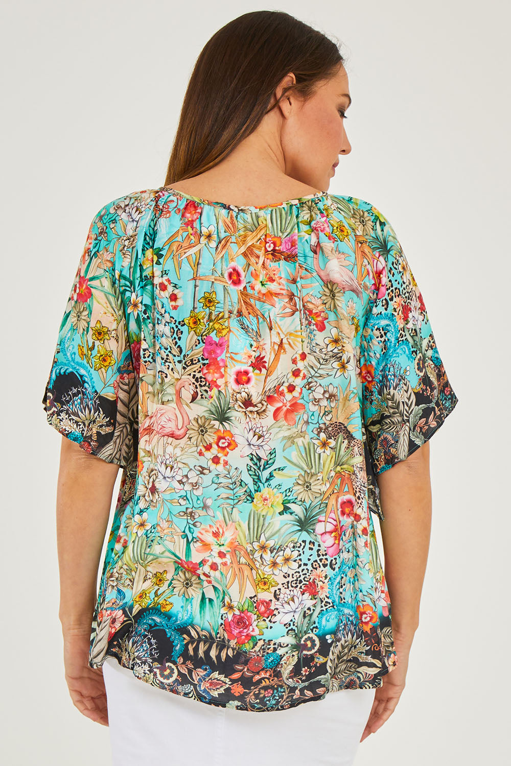 Model Georgia wearing size S of the Larisa Top in colour Mist (Blue), from the back