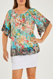 Model Georgia wearing size S of the Larisa Top in colour Mist (Blue), from the front, cropped image
