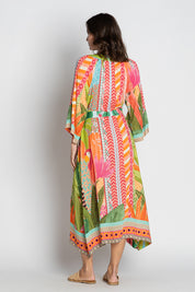 A model wearing the Los Cabos Midi Dress in colour Mist, from the back