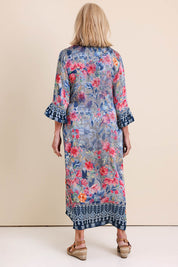 Model Sandys wearing size 10 of the La Maroma Dress – Indigo in colour Indigo, from the front