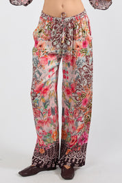 Model Genericm wearing size sample of the La Maroma Pant – Espresso in colour Espresso, in a cropped view