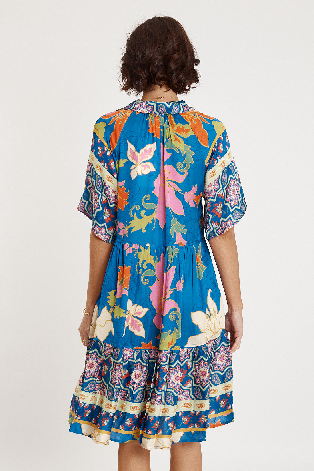 A model wearing the Marquis Modal Blend Dress in colour Ocean (Blue), from the back