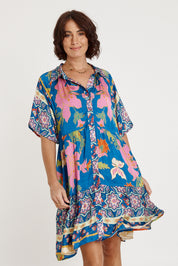 A model wearing the Marquis Modal Blend Dress in colour Ocean (Blue), from the front, cropped image