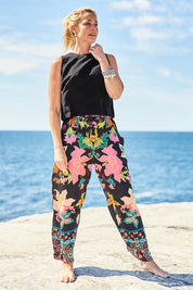 Model Bianca wearing size S of the Marquis Modal Blend Pant in colour Black (Black), from the front, showing the whole outfit