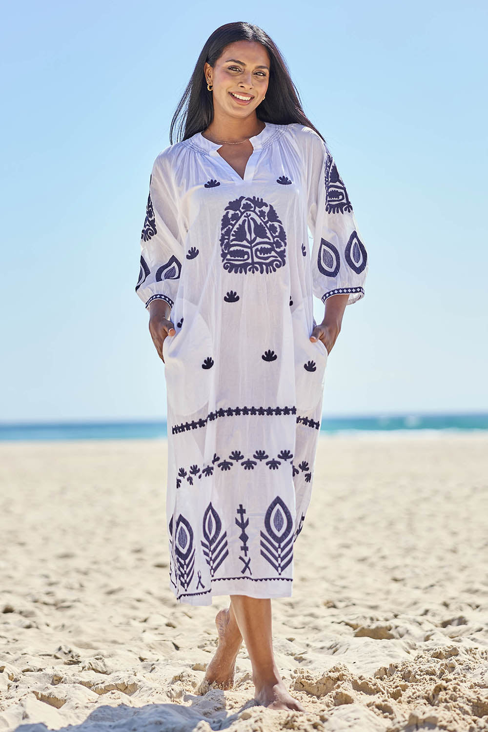Model Eshan wearing size 10 of the Milano Kaftan Dress - White in colour White, from the front